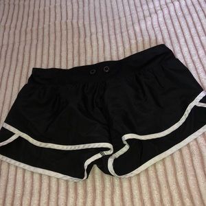 Plain black shorts.